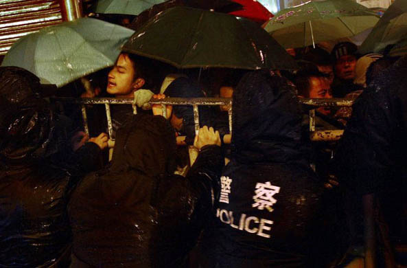 Police block passengers trying to enter the railway station in Guangzhou