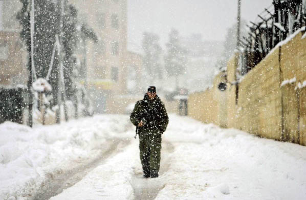 A member of Mahmoud Abbas' security force outside the presidential compound