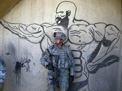 Staff sergeant Jason Redick stands outside an abandoned gym thought to have been used as a vantage point by insurgent gunmen in al-Hadar, in southern Baghdad
