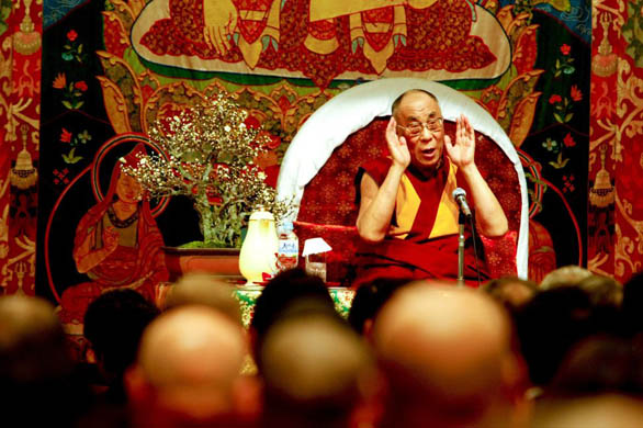 Exiled Tibetan spiritual leader Dalai Lama speaks to the audience during a lecture