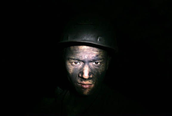 A worker in a pit at the Moxinpo colliery