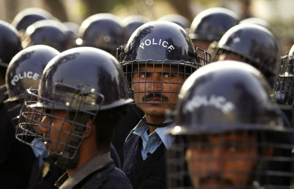 Riot police prepare for demonstrators rallying against president general Pervez Musharraf