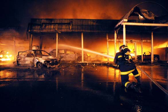 A fireman puts out a fire