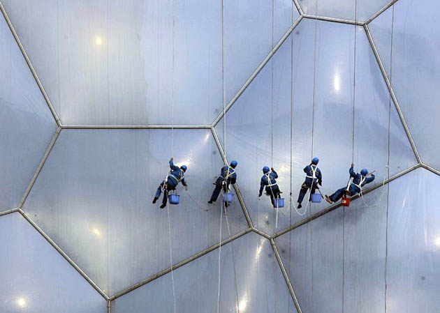 Beijing, China: Workers clean the National Aquatics Centre