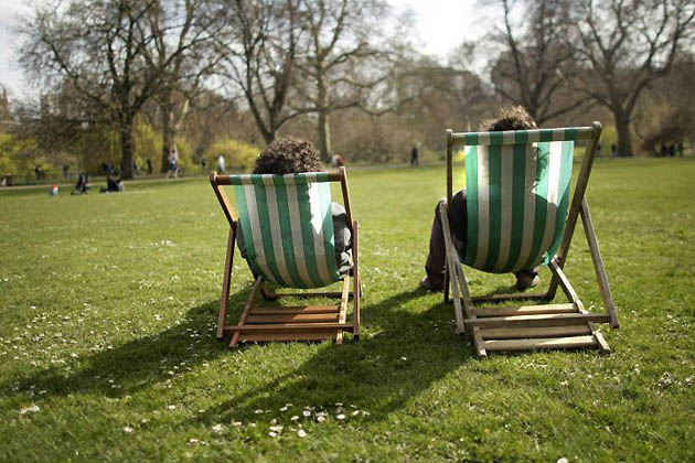 London, UK: Visitors enjoy the spring sunshine in St James Park