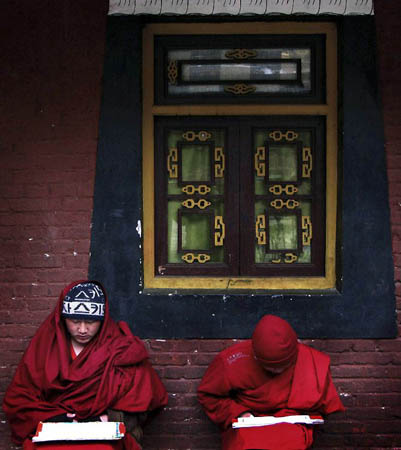 Kangding, China: Young Tibetan monks debate over Buddhist philosophy at the Nanwu temple