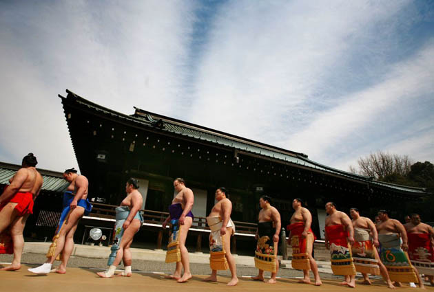 Tokyo, Japan: Sumo wrestlers walk through Yasukuni shrine