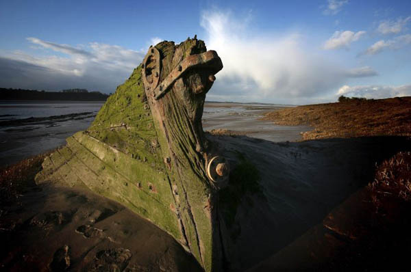 Gloucestershire, UK: Some of the abandoned historic vessels in the boat graveyard between Sharpness and Purton on the banks of the river Severn