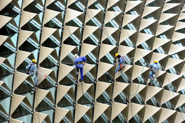 Workers cleaning the Esplanade theatre in Singapore
