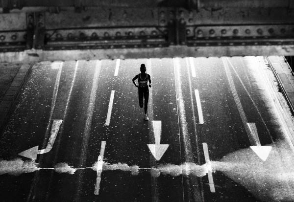 London, UK: Salina Kosgei of Kenya runs along Embankment during the 2008 Flora London Marathon