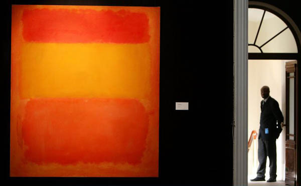 London, UK: A Sotheby's security guard stands at a gallery entrace . Mark Rothko's 'Orange, Red, Yellow'  is estimated to sell for in excess £30m