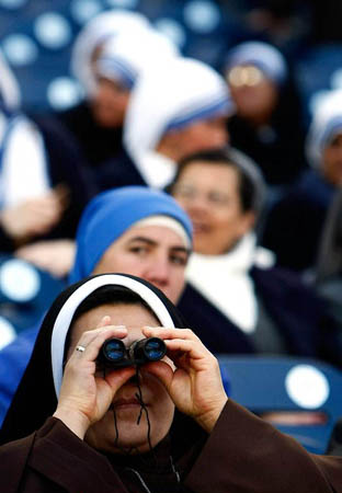Washington, US: A nun watches the opening services before Pope Benedict XVI celebrates Mass at Nationals Park