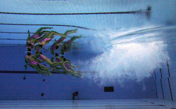 Beijing, China: The Japanese swimming team competes during the technical routine in the 'Good Luck Beijing' Olympic Games Synchronized Swimming Qualification Tournament