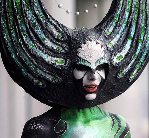 Moscow, Russia: A model displays the art work painted on her body during an international tattoo convention