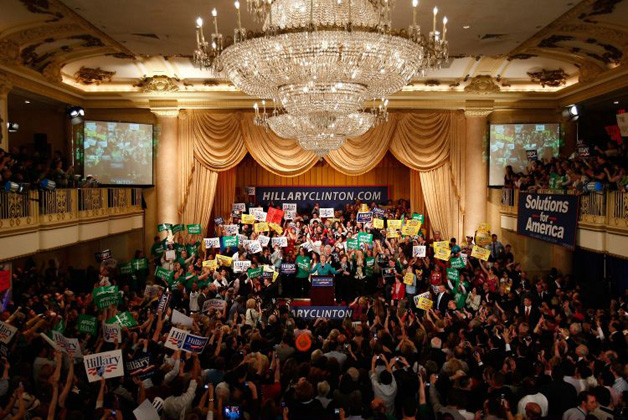 Hilary Clinton celebrates on stage with Bill Clinton and daughter Chelsea
