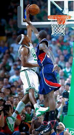 Boston Celtics forward Paul Pierce takes a shot over the defending Atlanta Hawks guard Joe Johnson