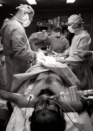 Photographer John D McHugh in Afghanistan