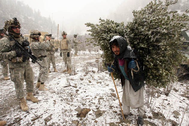 Photographer John D McHugh in Afghanistan