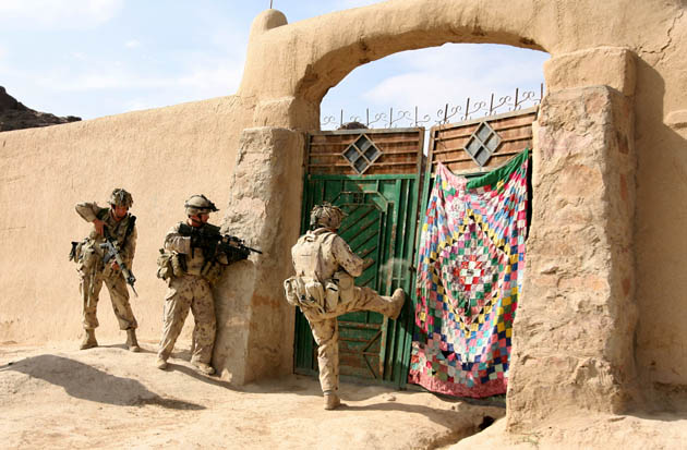 Photographer John D McHugh in Afghanistan