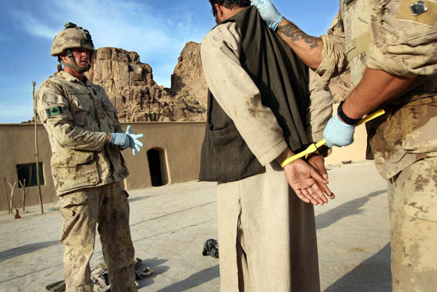 Photographer John D McHugh in Afghanistan