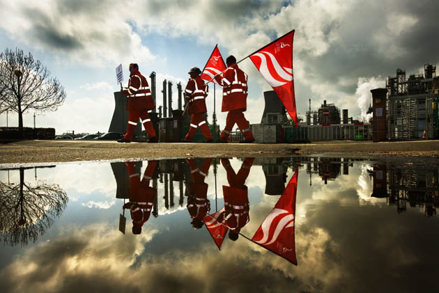 Striking workers from the INEOS Grangemouth oil refinery hold a rally outside the oil plant