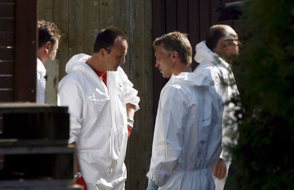 A police forensic team outside the house