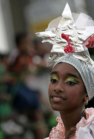 Havana, Cuba: A girl dances during the annual carnival procession