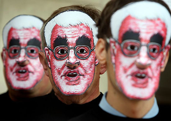 London, UK: CAMRA members wearing masks bearing the face of Alistair Darling campaign outside the Great British Beer Festival for a reduction in beer tax