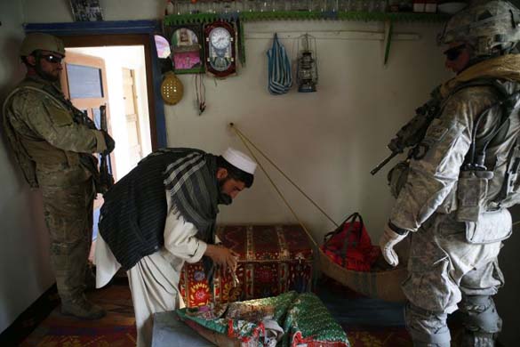 Soldiers conduct a house search, Afghanistan