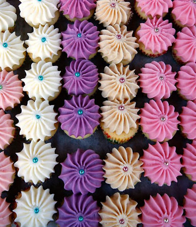 London, UK: A tray cupcakes for sale on the 'Violet' stall during the first night of Covent Garden food market