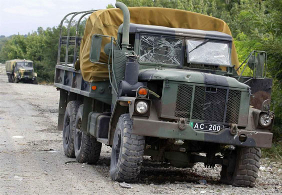 Damaged Georgian military trucks are seen on a road near the town of Tskhinvali near the border with South Ossetia 