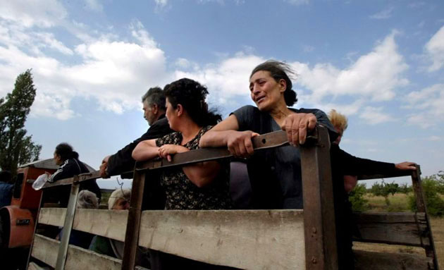 Georgian people leave the conflict zone in South Ossetia 