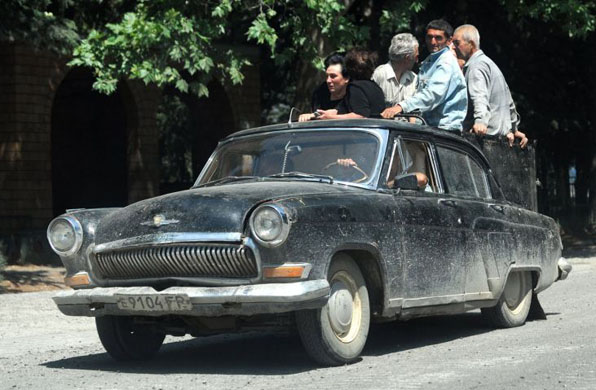 Georgians flee in an old Soviet built car in South Ossetia 