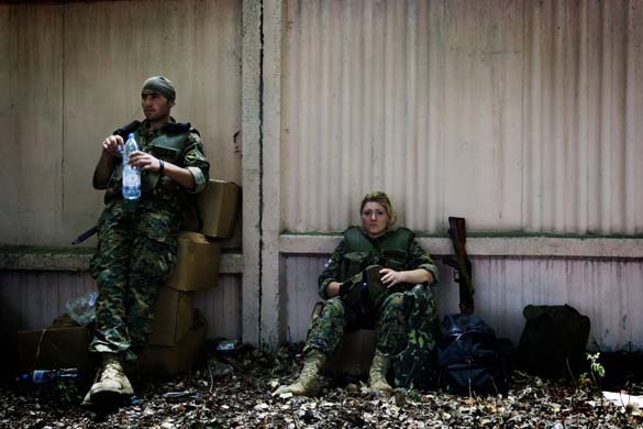Georgian soldiers rest outside Gori
