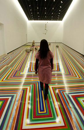 Melbourne, Australia: A woman walks through an art installation by Jim Lambie at the Australian Centre for Contemporary Art