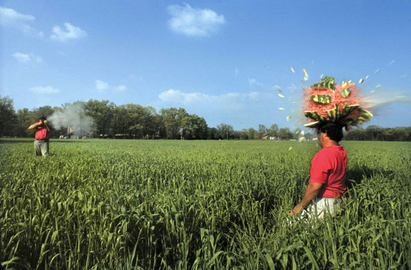 John Richmond shooting a watermelon on top of his brother's head  