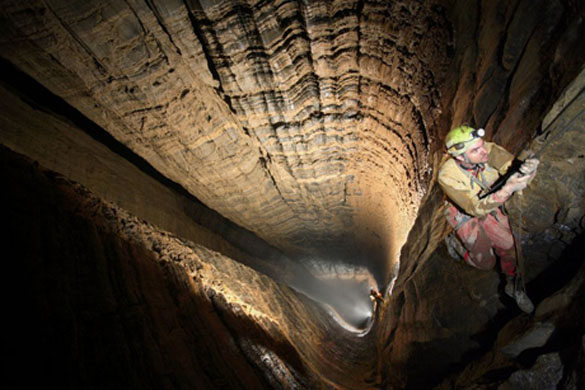 Climbers abseil down one of the world's deepest shafts. The Miao Keng, in south-west China