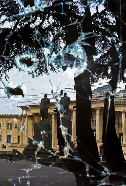 Gori, Georgia: The reflection in a broken window of a statue of former Soviet dictator Josef Stalin