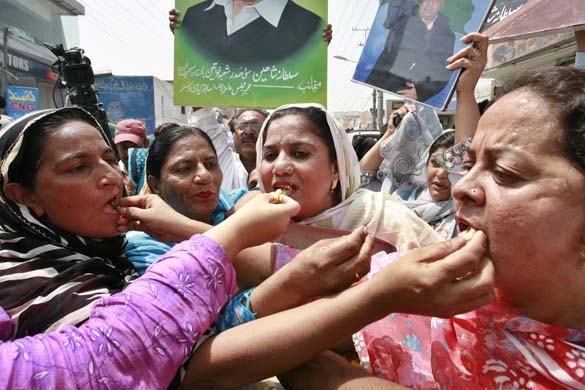 Muslim League-N party share sweets