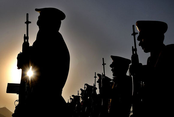 Kabul, Afghanistan: A guard of honor stand in a attention during a ceremony marking the anniversary of Afghanistan's Independence Day