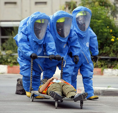 Haifa, Israel: Soldiers wearing protection suits participate in a chemical missile attack drill