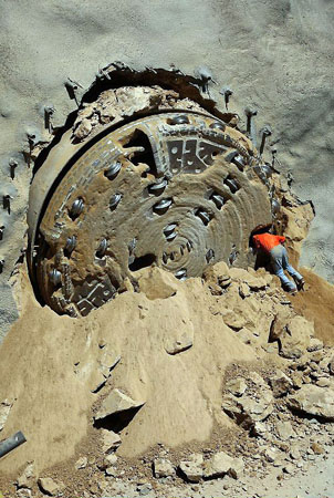 San Bernardino, US:  A miner talks to a colleague after the drilling of a four-mile-long, 19-foot-diameter tunnel