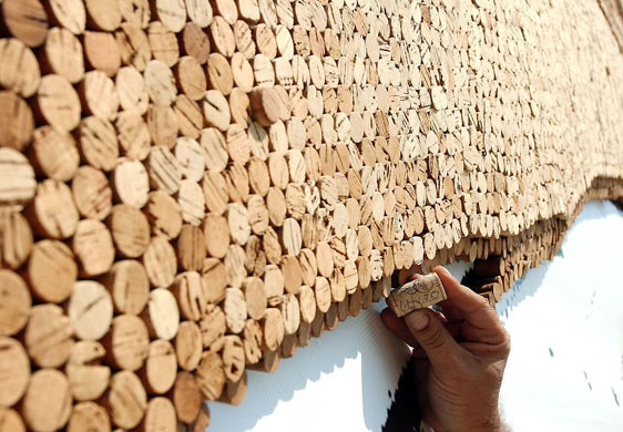 Tirana, Albania: Saimir Strati works on 'The Guitarist' cork mosaic