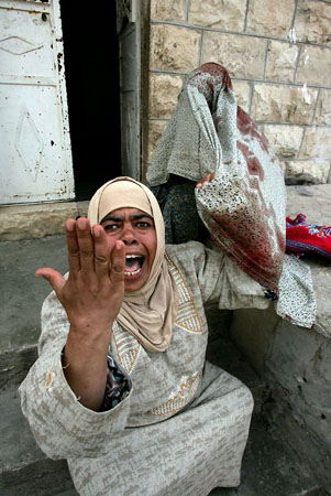 Nilin, West Bank: A woman reacts after a youth was wounded in clashes between Palestinian protestors and Israeli forces during a demonstration