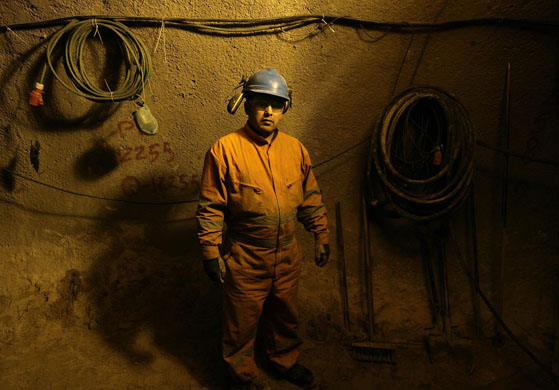 Santiago, Chile: A worker inside a subterranean tunnel constructed for the cleaning up of the Mapocho river