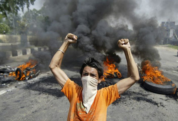 Jammu, India: A protester shouts slogans against Jammu and Kashmir state leaders