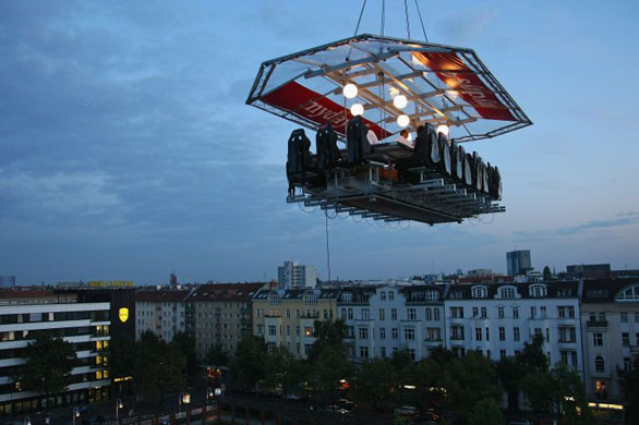 Berlin, Germany: Sixteen guests partake in a four-course dinner at a table approximately 50 metres above the ground