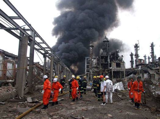 Guangxi Yizhou, China: Rescuers work at the site of an explosion at a chemical plant