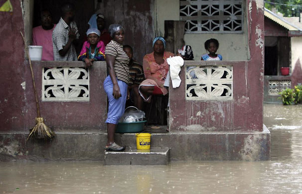 Leogan, Haiti: A family during heavy rains caused by Hurricane Gustav