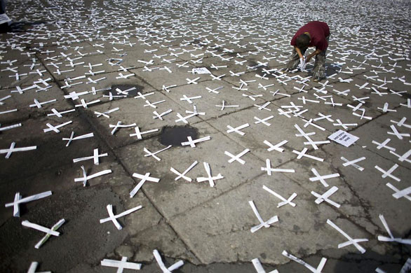Mexico City, Mexico: An anti-abortion activist displays crosses during a protest against a law that legalizes abortion